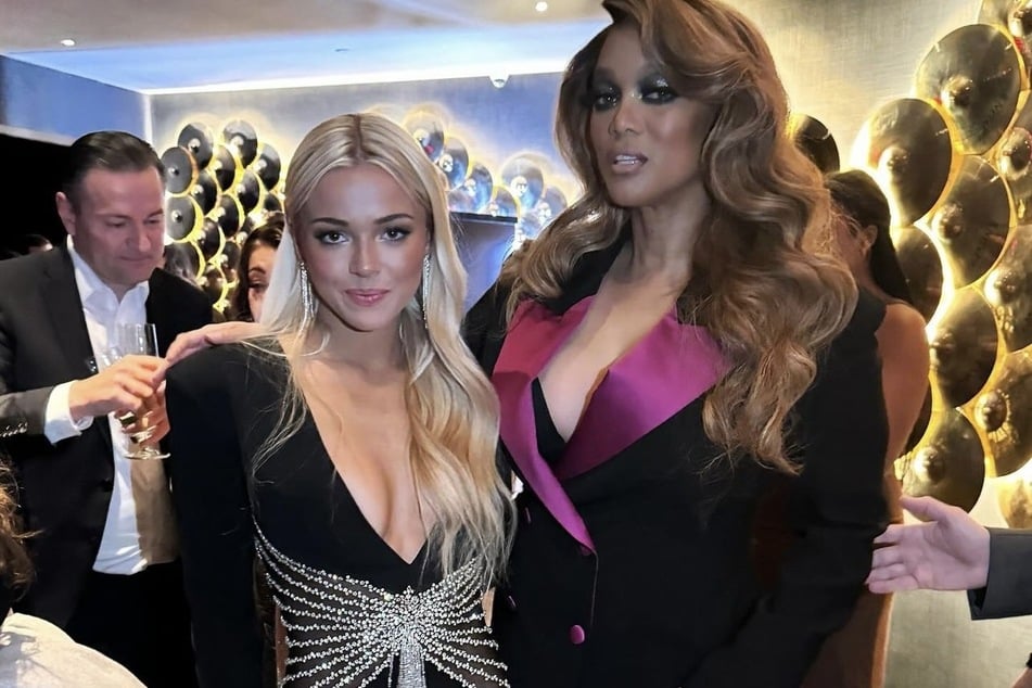 Olivia Dunne's (l.) "smize" picture with model icon Tyra Banks became a fan favorite moment.
