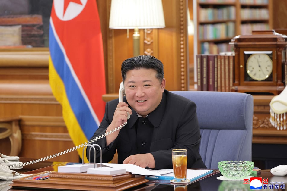 North Korean leader Kim Jong Un holds a telephone conversation with Russian President Vladimir Putin at an undisclosed location on August 12, 2025.