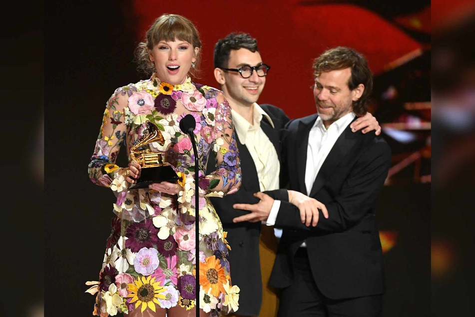 Taylor Swift (l), Jack Antonoff (c.), and Aaron Dessner (r.) accept the Album of the Year award for Folklore onstage during the 63rd Annual Grammy Awards on March 14, 2021 in Los Angeles, California.