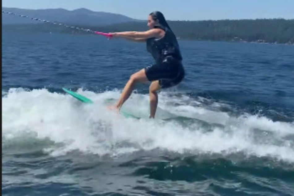 Never give up! Kim Kardashian gets back on the board after hilariously failing the first time.