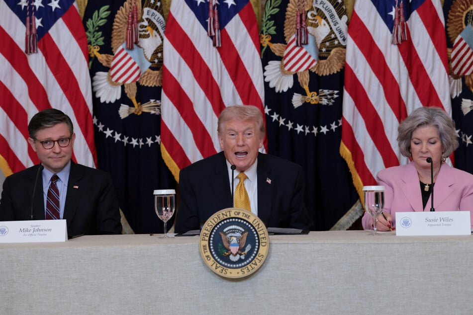 At one point, Mike Johnson (l.) admitted that President Trump (c.) was revealing information about a congressman's health that "wasn't public."