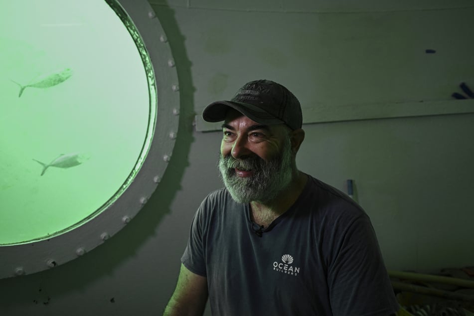 German aerospace engineer Rudiger Koch talks during an AFP interview inside an underwater room off the coast of Puerto Lindo, Panama, on November 26, 2024.