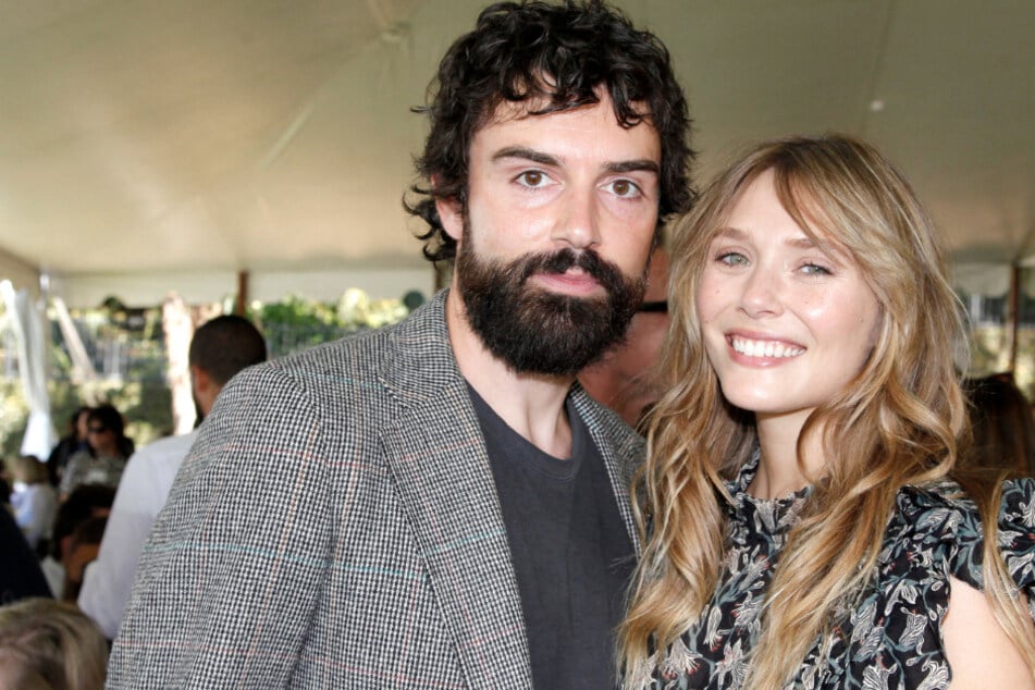 Elizabeth Olsen (r) is expecting her first baby with husband Robbie Arnett (l.)