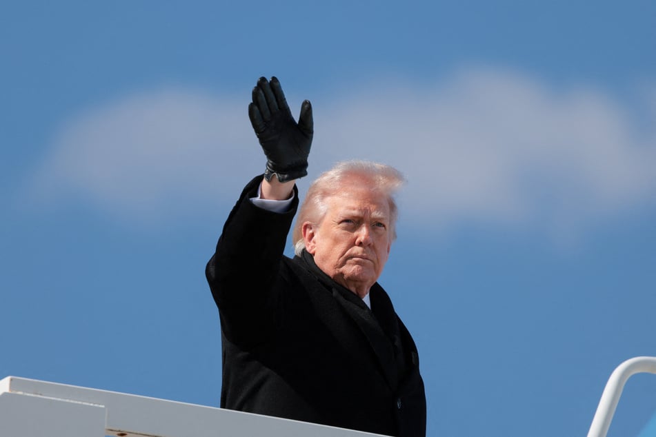 President Donald Trump waves as he boards Air Force One to travel to Joint Base Andrews, at Dover Air Force Base in Delaware, on March 18, 2026.