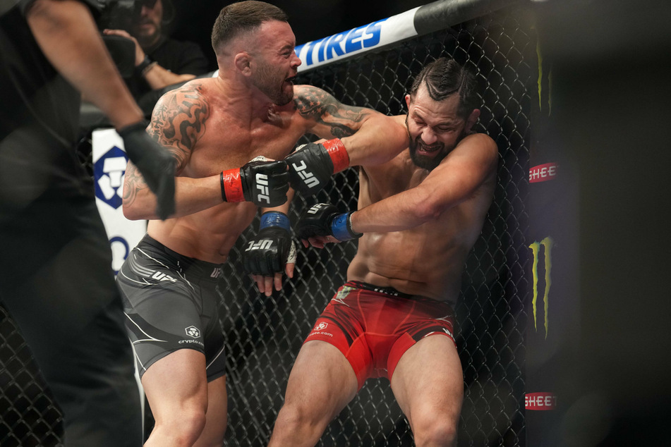 Colby Covington punches Jorge Masvidal in their Welterweight bout during UFC 272 on March 5.