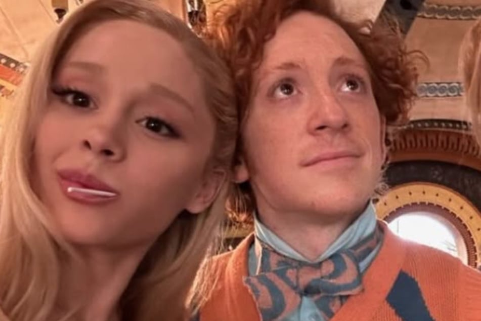 Ariana Grande (l.) and Ethan Slater (r.) adorably pose together in rare behind-the-scenes pics from Wicked: Part 1.