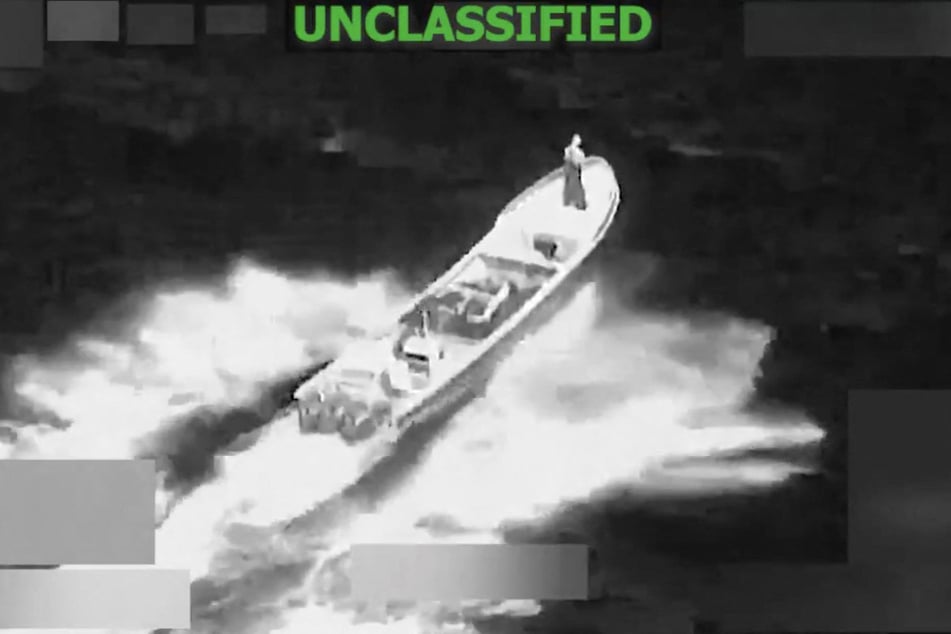 This screen grab from a video posted on the X account of US Southern Command (SOUTHCOM) on Monday shows a strike at the direction of Defense Secretary Pete Hegseth on a vessel alleged to be transiting along narco-traficking routes on Monday in "international waters."