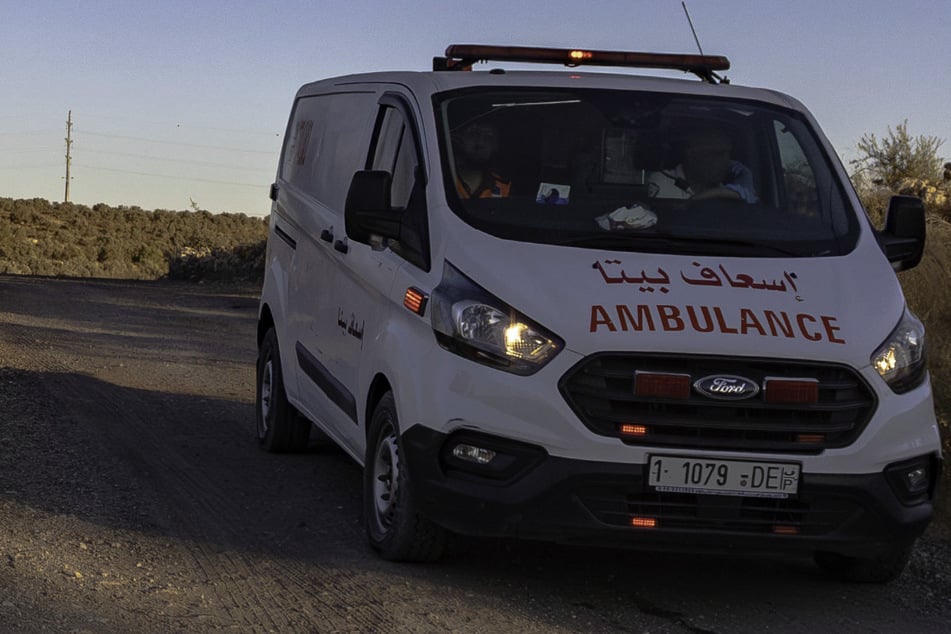 The Palestinian Red Crescent said a teenager in the West Bank had been shot in the chest during a raid by settlers backed by Israeli troops.