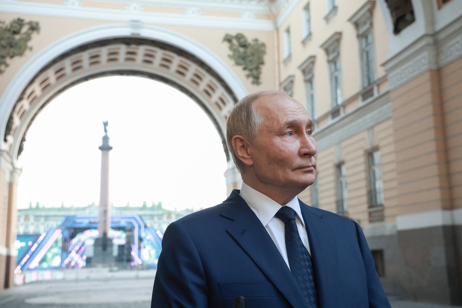 In this pool photograph distributed by the Russian state agency Sputnik, Russia's President Vladimir Putin answers a journalist's question after delivering a speech at the X St. Petersburg International United Cultures Forum in Saint Petersburg on Thursday.