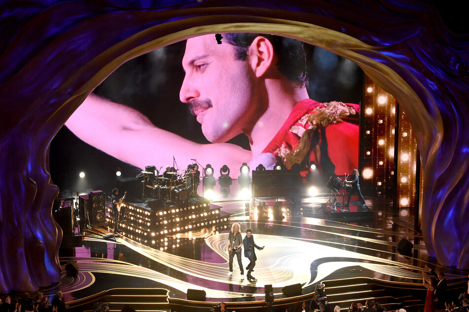 The memory of Freddie Mercury lives on though the performances of Adam Lambert + Queen, pictured performing onstage during the 91st Annual Academy Awards in 2019.