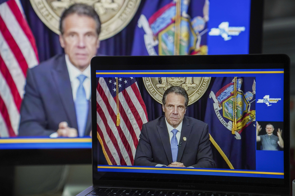 Cuomo announcing his resignation in August as pressure mounted.