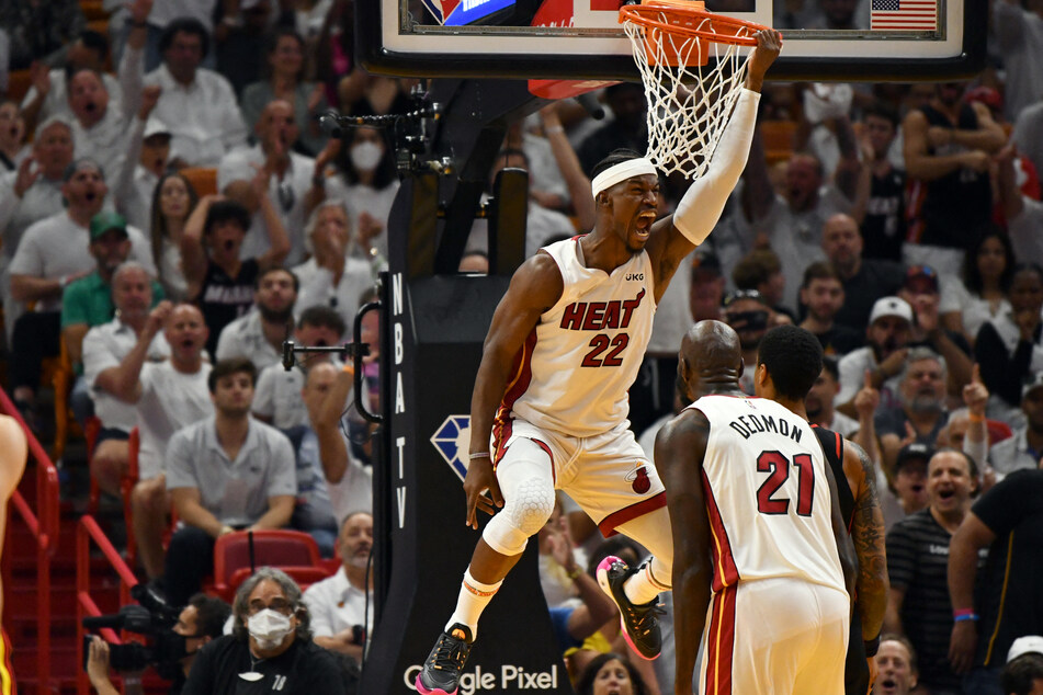 Miami Heat forward Jimmy Butler lets out a yell after dunking the ball against the Atlanta Hawks.
