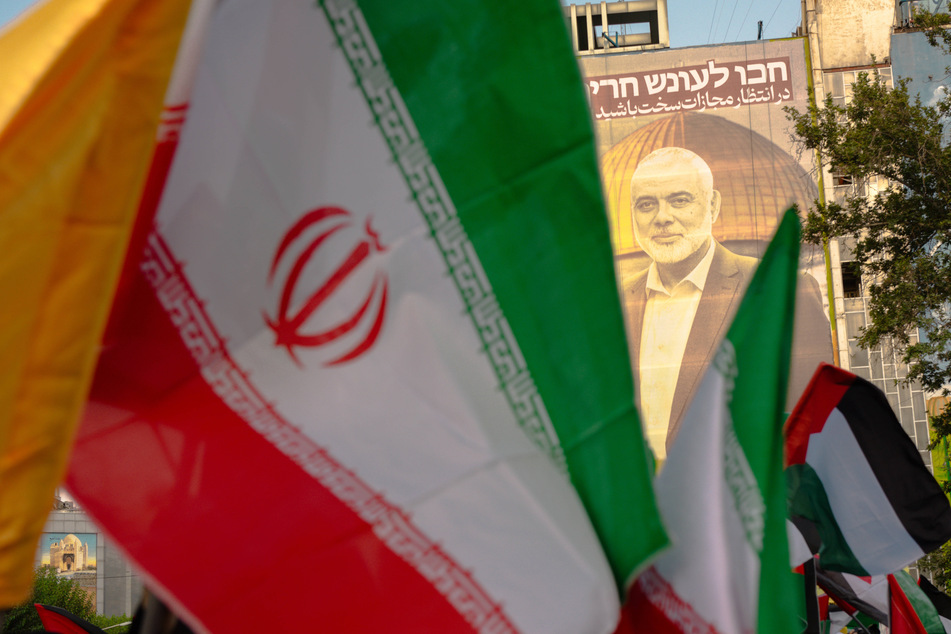 A US official warned Friday that Iran would face "cataclysmic" consequences if it strikes Israel in response to the killing of a top Hamas official.