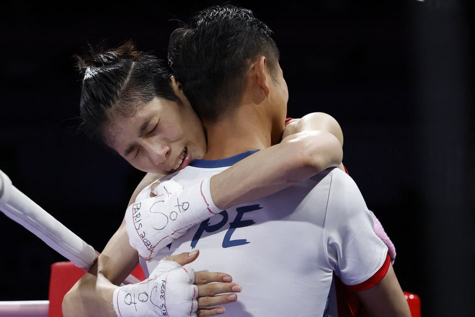 Lin Yu-ting of Taiwan reacts after winning her fight against Svetlana Kamenova Staneva of Bulgaria.