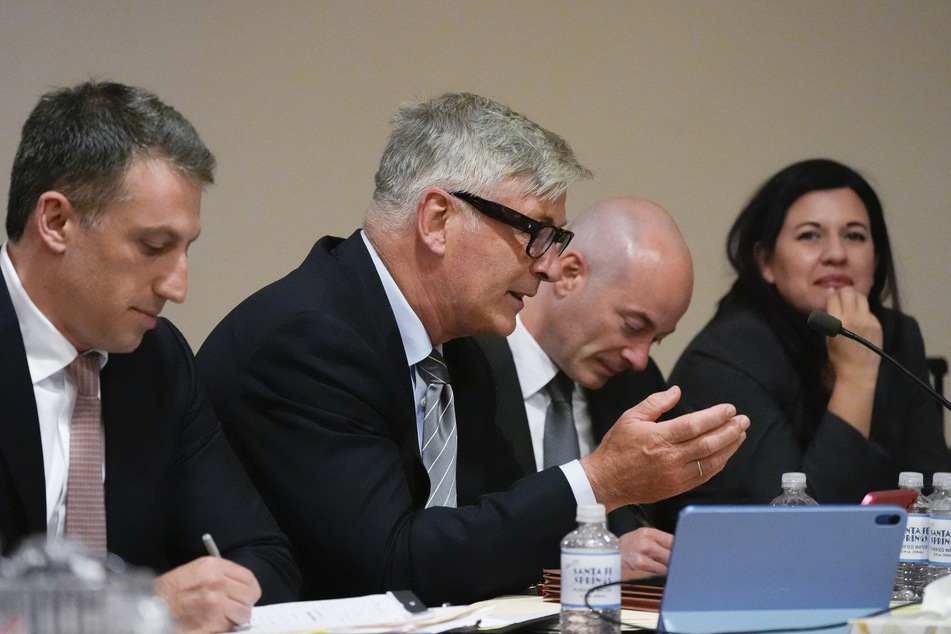 (L-R) Lawyer Alex Spiro, actor Alec Baldwin, lawyer Luke Nikas, and lawyer Heather LeBlanc participate in a pretrial hearing in Santa Fe, New Mexico, on Monday.