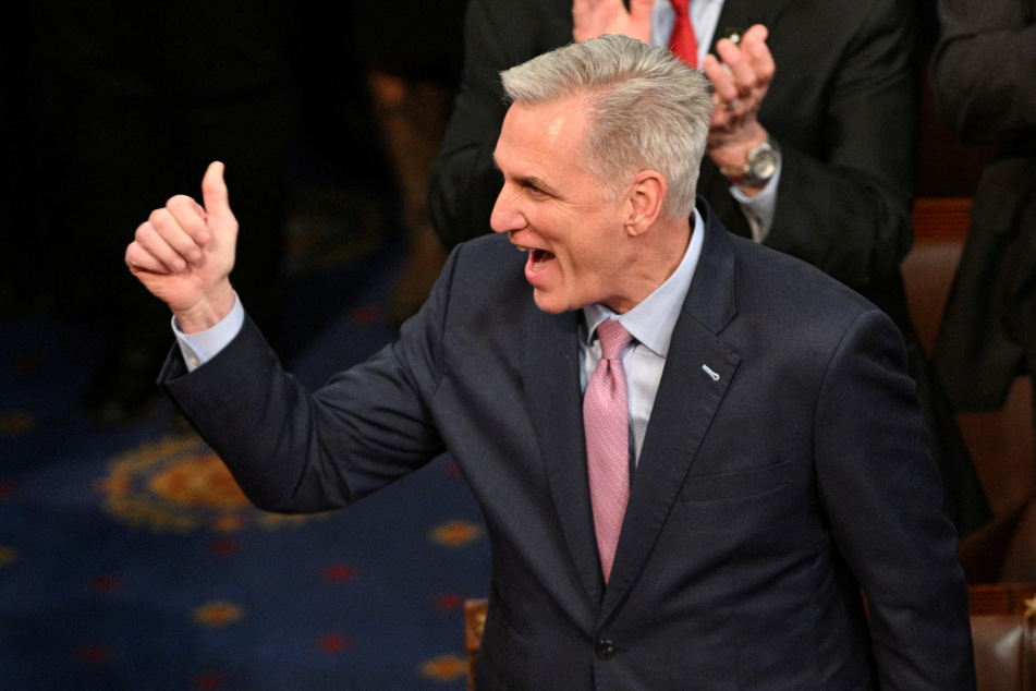 US House Republican Leader Kevin McCarthy celebrates being elected the next Speaker of the House in a late-night 15th round of voting during the fourth session of the 118th Congress.
