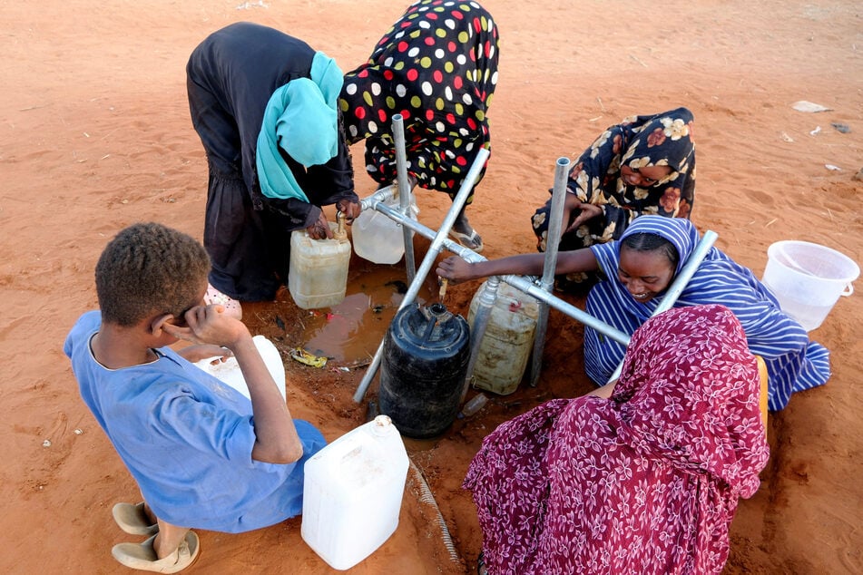 Displaced women fill water at displaced persons camp in El Obeid, North Kordofan State, Sudan, on January 12, 2026.