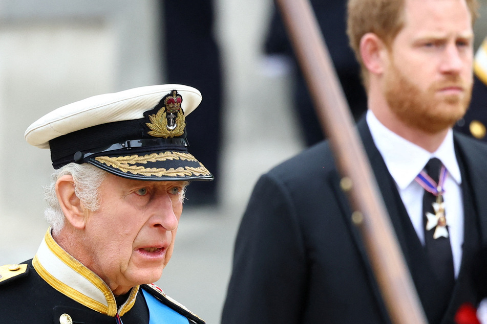 Britain's King Charles (l.) and Britain's Prince Harry (r.), Duke of Sussex attend the state funeral and burial of Britain's Queen Elizabeth, in London, Britain, September 19, 2022.