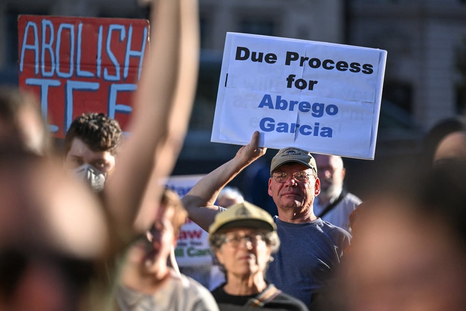 Supporters demonstrate as Kilmar Abrego Garcia arrives at an ICE field office in Baltimore, Maryland, on August 25, 2025.