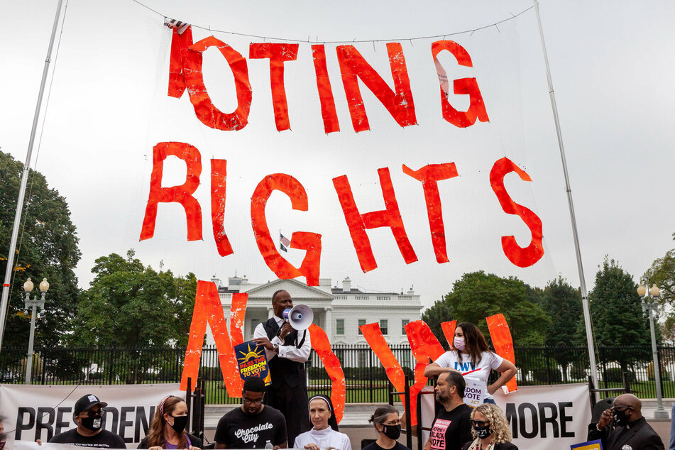 Voting rights activists surround the White House demanding action to secure ballot access.