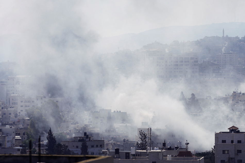 Smoke rises during an Israeli military operation in Jenin, in the Israeli-occupied West Bank.
