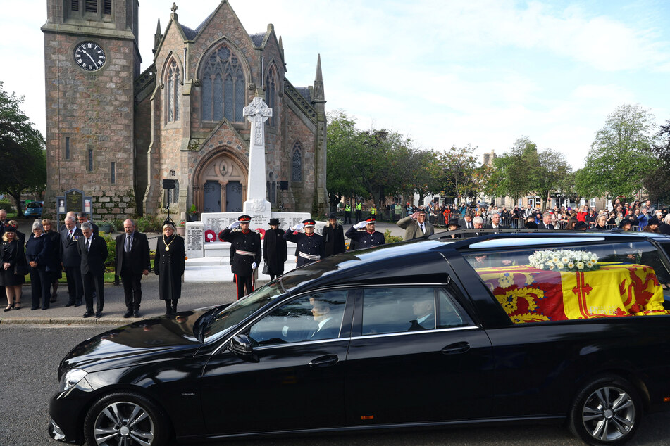 The hearse carrying the coffin of the UK's Queen Elizabeth II passes through the village of Ballater, near Balmoral, Scotland.