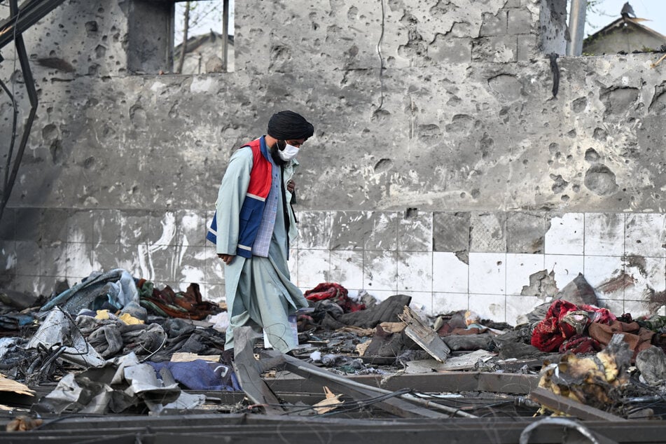 Crowds have gathered as family members desperately seek news about their loved ones after the horrific strike.
