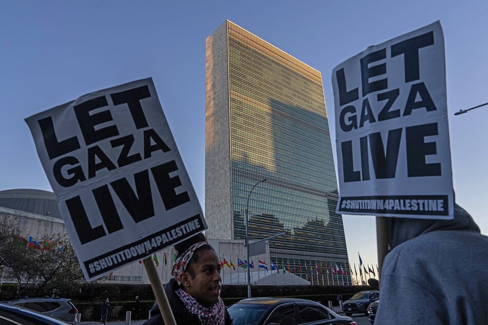 Demonstrators gather outside United Nations headquarters before members of the UN Security Council meet to vote on a draft resolution to authorize an International Stabilization Force in Gaza, on November 17, 2025.