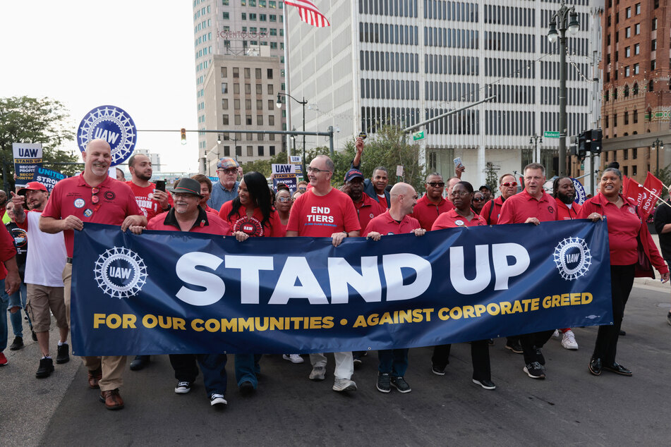 United Auto Workers president Shawn Fain and members march on the first day of their historic strike in Detroit, Michigan.