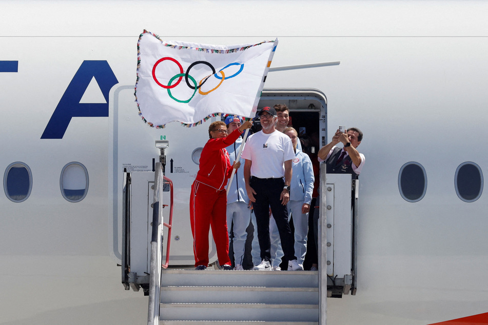 Mayor Karen Bass and LA28 Chairman Casey Wasserman return the official Olympic flag to Los Angeles for the first time in 40 years ahead of the 2028 Games.