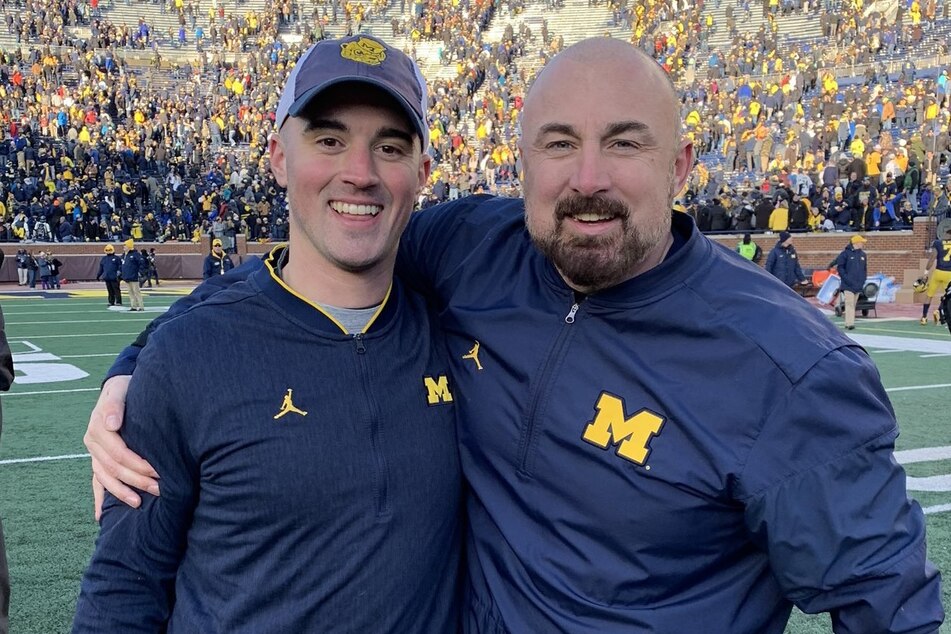 The NCAA's shocking new evidence against Michigan has reignited the cheating scandal with the Wolverines firing coach Chris Partridge (r).