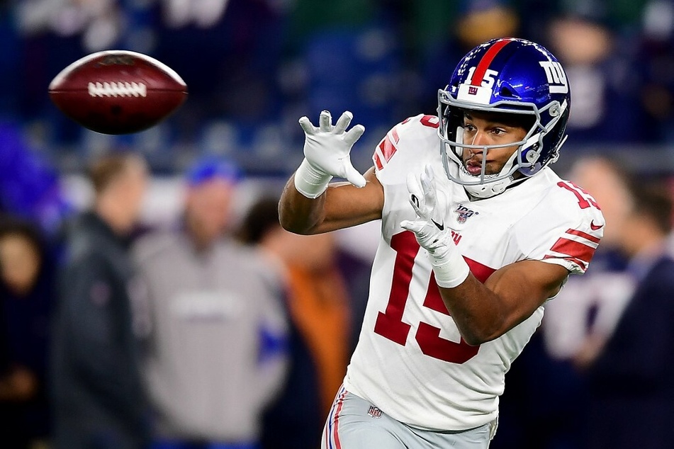 Former NFL receiver Golden Tate catches a pass in a game against the New England Patriots.