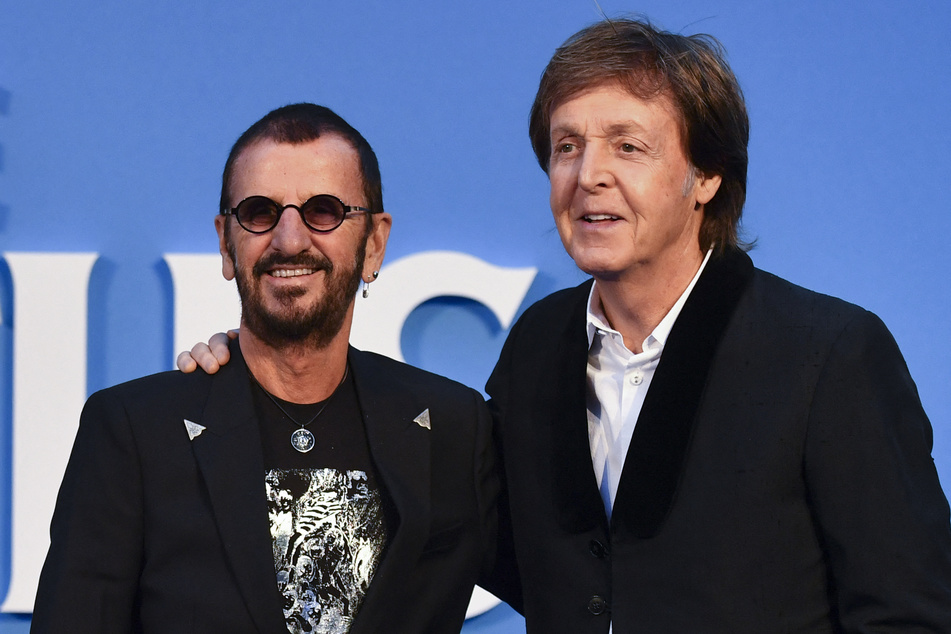 Paul McCartney (R) and Ringo Starr (L) of The Beatles pose together on the carpet of the film The Beatles Eight Days A Week: The Touring Years on September 15, 2016.