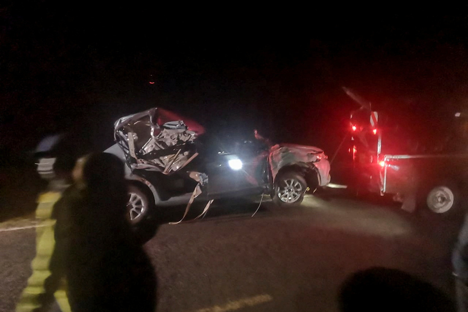 The wreckage of the vehicle in which Kenya's marathon world record holder Kelvin Kiptum and his coach were killed is towed from the scene of the accident near the Rift Valley town of Eldoret.