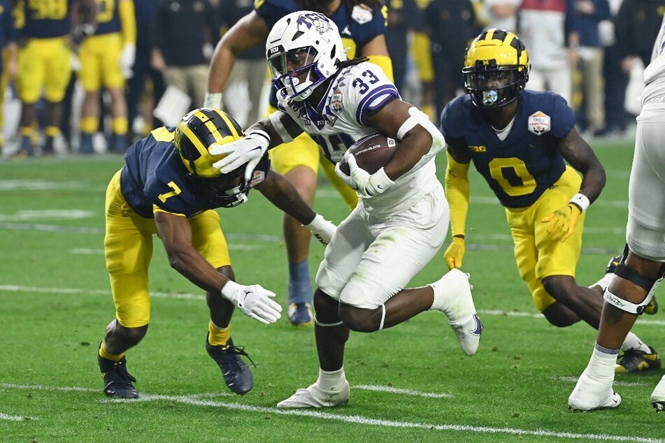 TCU starter Kendre Miller's (c.) knee injury has improved, and his chances at playing in the CFP National Championships on Monday are stronger than previously reported.
