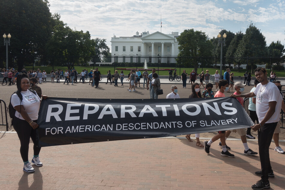 Activists demonstrate at the White House in 2021, demanding reparations for Black Americans.