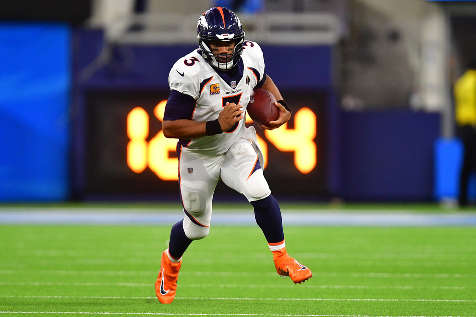 Denver Broncos quarterback Russell Wilson runs the ball against the Los Angeles Chargers during the second half at SoFi Stadium.
