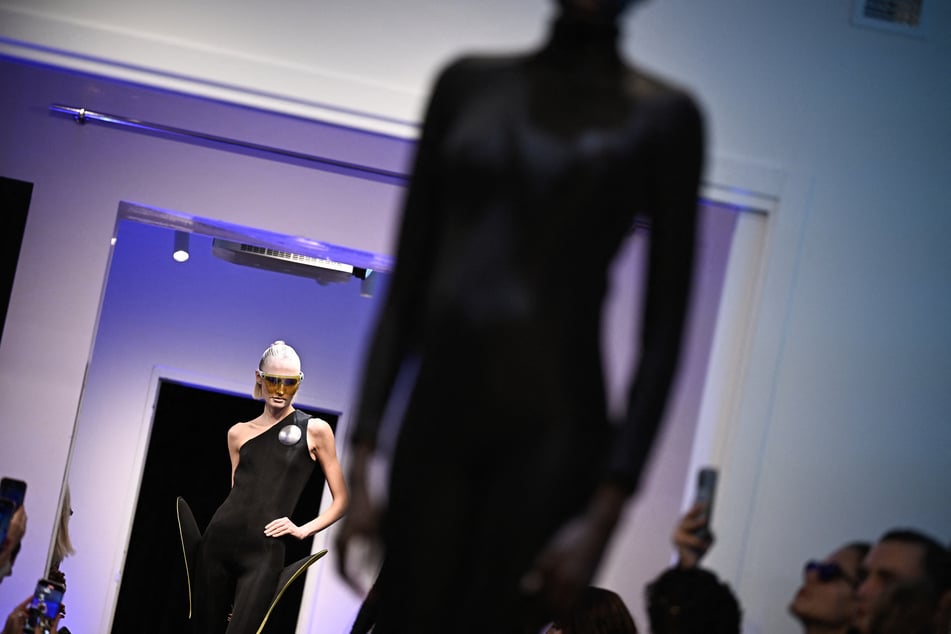 A model presents a creation by Pierre Cardin for the Women Ready-to-wear Spring-Summer 2026 collection as part of the Paris Fashion Week, in the historic boutique at 59 rue du Faubourg Saint-Honore in Paris on October 7, 2025.