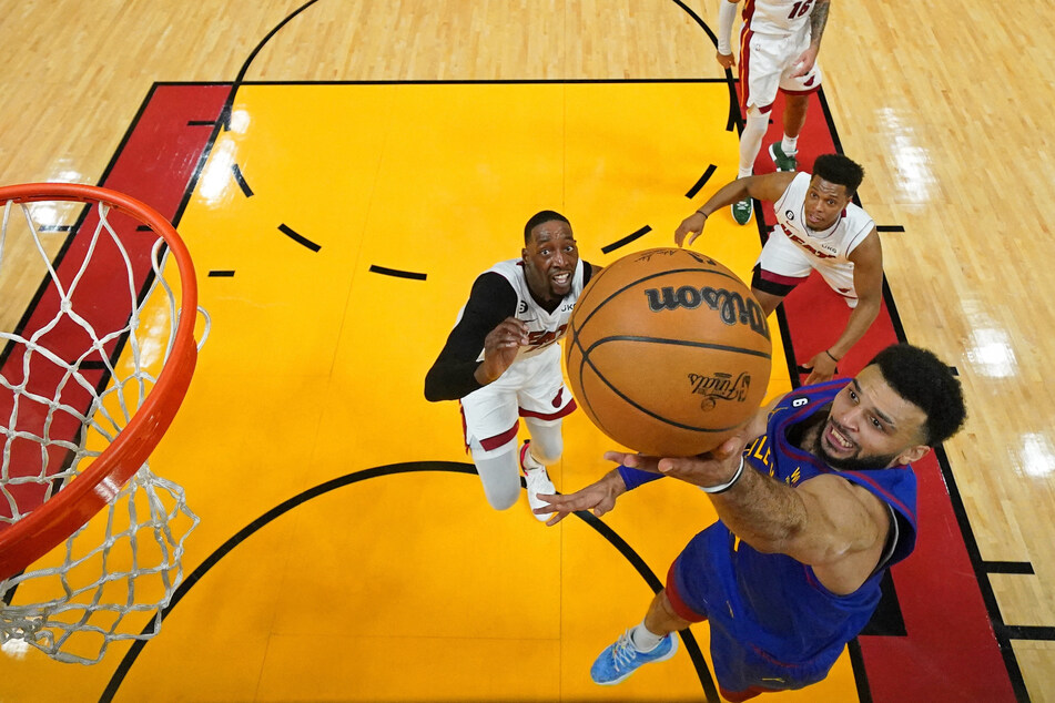 Denver Nuggets guard Jamal Murray shoots the ball against the Miami Heat during the first half in Game 3 of the 2023 NBA Finals at Kaseya Center.