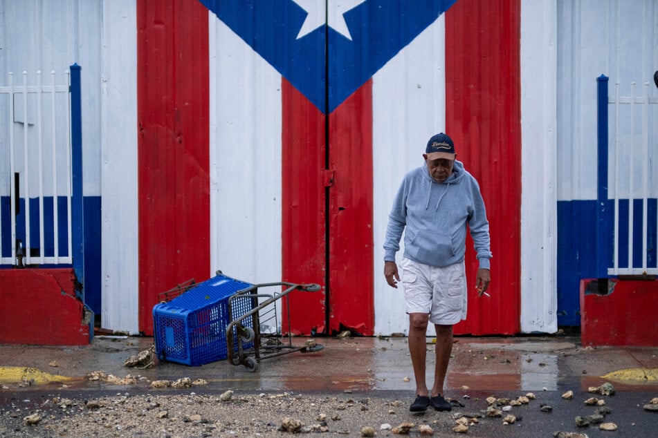 A resident surveyed the aftermath of Hurricane Fiona in Penuelas, Puerto Rico on Monday.