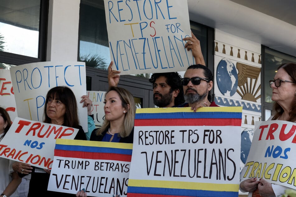 Miami-Dade County Democratic Party Chair Laura Kelley (second l.) joins with others to support a resolution in favor of reinstating TPS for Venezuelans on February 13, 2025.