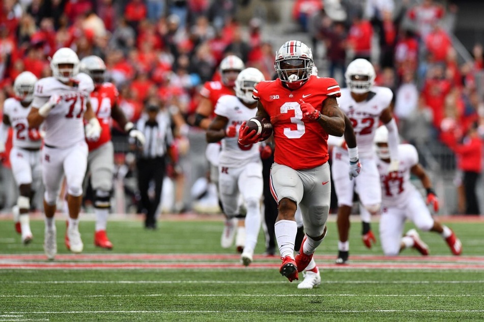 Miyan Williams of the Ohio State Buckeyes runs with the ball during the third quarter of a game against the Rutgers Scarlet Knights at Ohio Stadium.