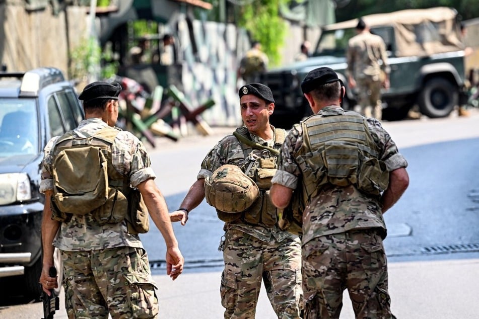 Lebanese army forces confer after responding to a shooting near the US embassy in Beirut.