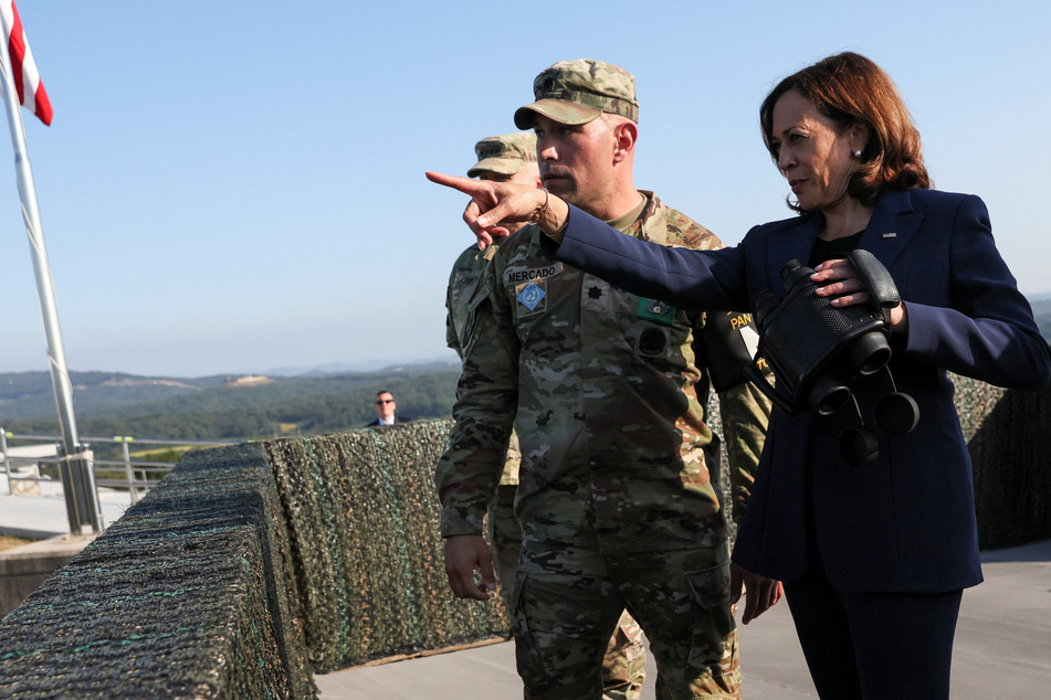 US Vice President Kamala Harris holds binoculars at a military observation post as she visits the demilitarized zone separating North and South Korea.