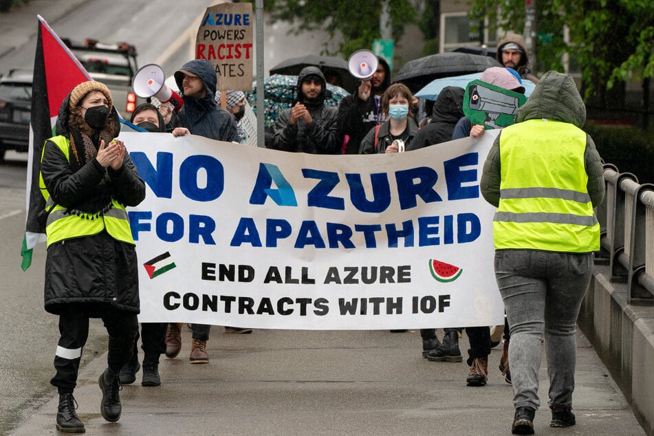 Demonstrators with the No Azure for Apartheid campaign call for the termination of Microsoft’s Azure contracts with Israel during a march in Seattle, Washington.