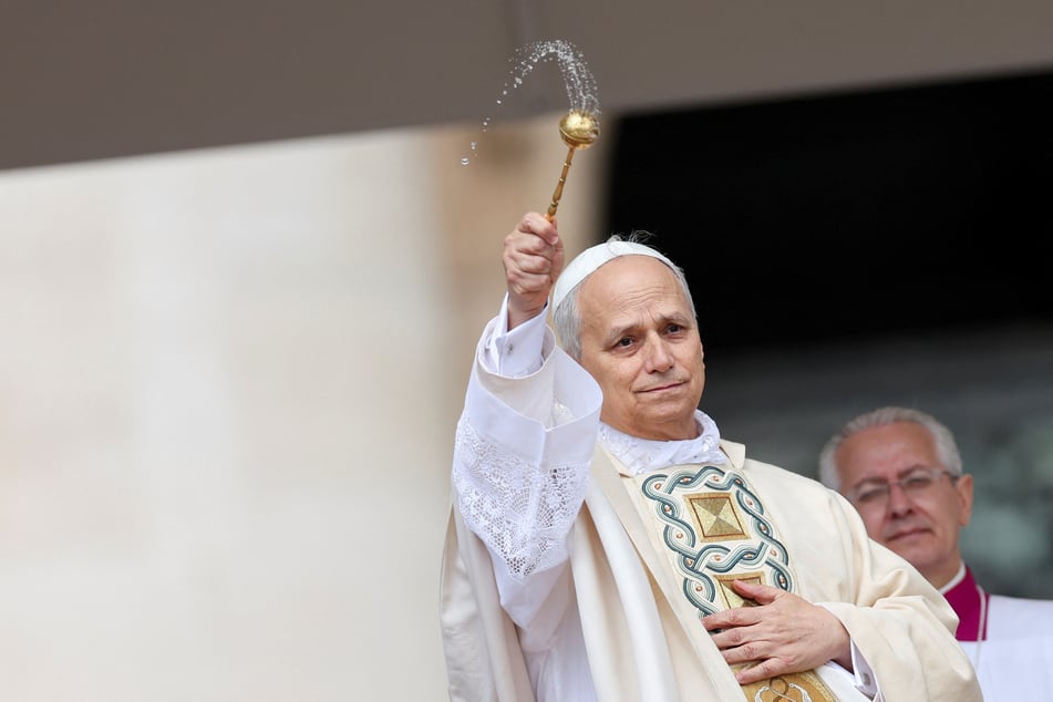 Pope Leo XIV blesses the faithful during his inaugural mass in St. Peter's Square at the Vatican on May 18, 2025.