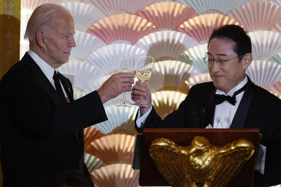 President Joe Biden (l.) and Japanese Prime Minister Fumio Kishida toast each other during a state dinner in the East Room of the White House on April 10, 2024.