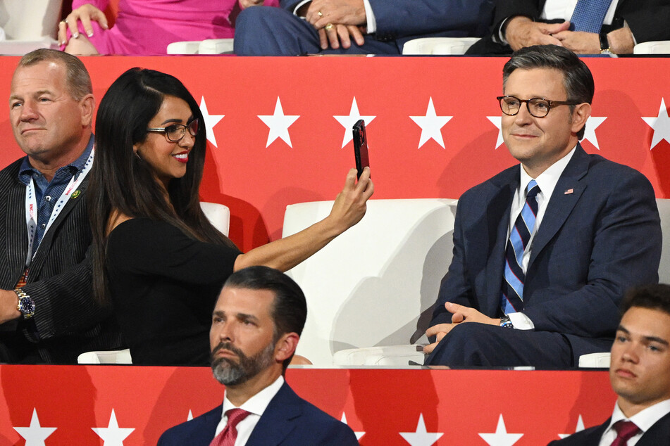 Congresswoman Lauren Boebert snaps pics for social of House Speaker Mike Johnson during the Republican National Convention in Milwaukee, Wisconsin on July 17, 2024.