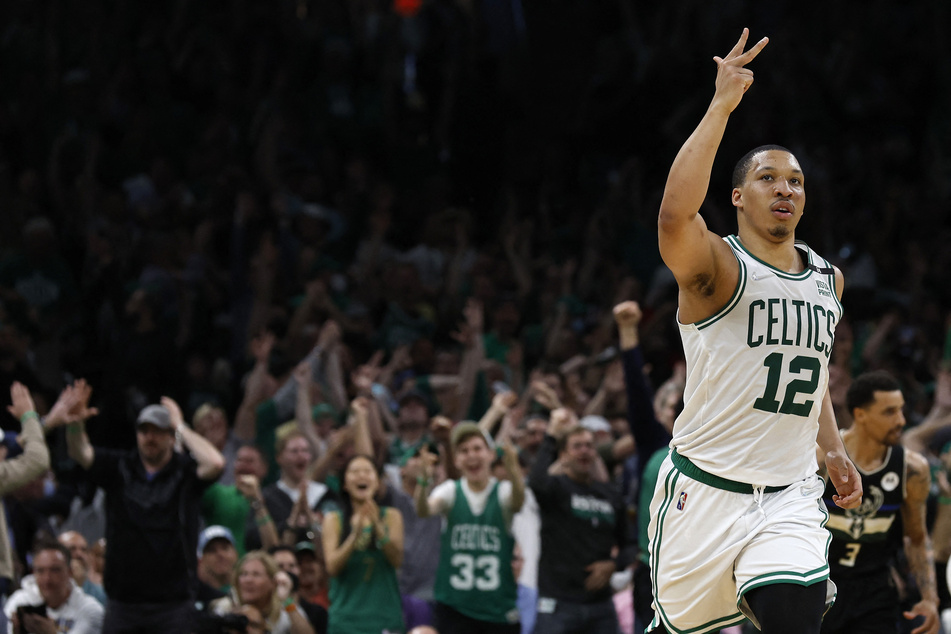Boston Celtics forward Grant Williams celebrates after scoring a three pointer against the Milwaukee Bucks.