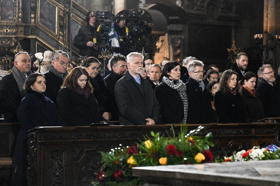Czech president Petr Pavel (c.) attends a mass commemorating the victims of the Charles University's shooting, at the St. Vitus Cathedral in Prague, on December 23, 2023.